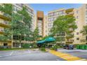 View of building entrance, covered by a green awning and marked with the address, 1800 at 1800 Clairmont Lk # A310, Decatur, GA 30033