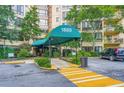 Covered building entrance with awning, landscaping, and a bench visible through the doorway at 1800 Clairmont Lk # A310, Decatur, GA 30033