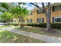 Apartment building with a manicured lawn, sidewalk, and mature trees in a garden-like setting at 3510 Roswell Nw Rd # N3, Atlanta, GA 30305