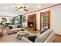 Cozy living room with a brick fireplace and an open view to the kitchen at 3089 Ranlo Dr, Atlanta, GA 30340