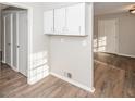 Hallway with wood-look flooring and built-in cabinets providing ample storage space at 3406 Blackberry Ln, Villa Rica, GA 30180