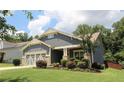 Well-kept home with stone accents, tidy landscaping, and a cozy front porch, perfect for relaxing at 5714 Pickens Garden Ln, Powder Springs, GA 30127