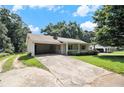 Exterior view of a one story home featuring a covered carport and charming front porch at 338 Patterson Rd, Lawrenceville, GA 30044