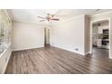 Spacious living room featuring hardwood floors, bright natural light, and neutral paint at 41 Elder St, Fairburn, GA 30213