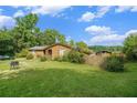 A cozy house with a large yard and a small storage building in the back at 1198 Old Mill Rd, Dallas, GA 30157