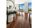 Bright living room with floor-to-ceiling windows and gleaming hardwood floors at 905 Juniper Ne St # 805, Atlanta, GA 30309