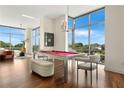 Spacious room featuring a billiard table and lots of natural light from large windows at 905 Juniper Ne St # 805, Atlanta, GA 30309