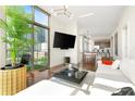 Stylish living room with modern decor, floor-to-ceiling windows, and city views at 905 Juniper Ne St # 805, Atlanta, GA 30309