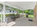 Covered back porch perfect for outdoor relaxing and grilling in a private backyard at 2483 Hunting Valley Dr, Decatur, GA 30033