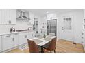 White kitchen with updated appliances, plenty of counter space and seating for your daily dining needs at 2658 Briarlake Ne Rd, Atlanta, GA 30345
