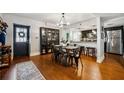 Open concept dining room featuring hardwood floors, modern lighting, and stainless steel kitchen appliances at 3048 Briarcliff Ne Rd # 9, Atlanta, GA 30329