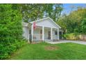 Charming craftsman-style home with covered front porch and lush lawn at 727 Holmes Nw St, Atlanta, GA 30318