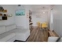 Open-concept layout showcasing a living room and dining area with modern decor and hardwood floors at 199 14Th Street Ne St # 2501, Atlanta, GA 30309