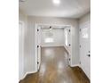 Inviting hallway showcasing dark wood floors and an entryway leading to a bright living area at 3695 Fox Hills Se Dr, Marietta, GA 30067
