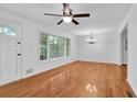 Bright living room featuring hardwood floors, ample natural light, and classic chandelier at 2286 Capehart Ne Cir, Atlanta, GA 30345