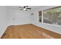 Well-lit living room boasting hardwood floors, fresh white walls, and a large window for natural light at 2286 Capehart Ne Cir, Atlanta, GA 30345