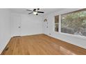 Inviting room with hardwood floors, bright white trim, and natural light from multiple windows at 2286 Capehart Ne Cir, Atlanta, GA 30345