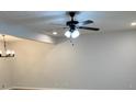 Bright living room featuring modern lighting and a neutral color palette at 7562 Asbury Manor Dr, Lithonia, GA 30014