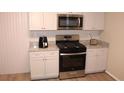 Well-equipped kitchen with stainless steel appliances and granite countertops at 4190 Wingfoot Ct, Decatur, GA 30035