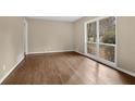 Bright living room featuring hardwood floors and a large window with a view at 4222 Webb Rd, Tucker, GA 30084