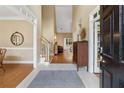 Grand foyer with tiled flooring, staircase, and views into the living spaces at 1125 Fairview Club Cir, Dacula, GA 30019