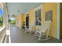 Charming front porch with rocking chairs and a vintage-style sign offering a welcoming atmosphere at 161 N Barton St, Norcross, GA 30071