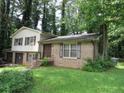 View of the two-story home showing the brick and siding exterior and front yard at 5114 Fawn Se Trl, Mableton, GA 30126