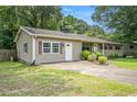 Charming home with a well-maintained lawn, providing a welcoming atmosphere and enhanced curb appeal at 96 S Forty Pass S, Hiram, GA 30141