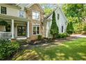This lovely home showcases manicured landscaping, a stone facade, and a cozy porch for relaxing outdoors at 1788 River Bluff Vw, Duluth, GA 30097