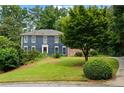 Lovely two-story home with blue siding, classic white trim, and a well-maintained front yard at 2340 Castleridge Ct, Tucker, GA 30084
