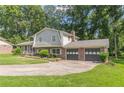 Charming home featuring a well-manicured lawn and a two-car garage at 3109 Albatross Ln, Decatur, GA 30034
