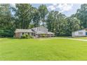 Charming home featuring a well-manicured lawn and a two-car garage at 3109 Albatross Ln, Decatur, GA 30034