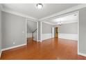 Elegant dining room with hardwood floors, wainscoting, and a chandelier at 1999 Barrett Knoll Nw Cir, Kennesaw, GA 30152