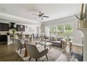 Open concept living area with lots of natural light and a view of the eat-in kitchen at 4808 Albany Way, Atlanta, GA 30331