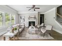 Cozy living room with a fireplace, white couches, and modern decor at 4808 Albany Way, Atlanta, GA 30331