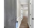 View of the home's entry way, featuring wood-look floors and neutral paint at 558 Newlin Ct, Lawrenceville, GA 30046