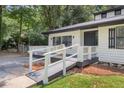 Inviting home featuring a convenient ramp leading to the front door at 558 Newlin Ct, Lawrenceville, GA 30046