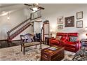 Bright and airy living room with hardwood floors and a staircase leading to the upper level at 3747 Sturbridge Ct, Tucker, GA 30084