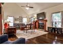 Inviting living room featuring a fireplace, hardwood floors, and comfortable seating at 3747 Sturbridge Ct, Tucker, GA 30084