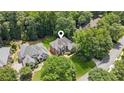 Aerial view of the property showcasing the home's location in a lush, tree-filled neighborhood at 1140 River Laurel Dr, Suwanee, GA 30024