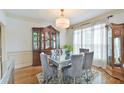 Traditional dining room boasting a beautiful china cabinet and hardwood floors at 4241 Hampton Mill Pkwy, Douglasville, GA 30135