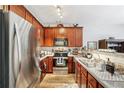 Well-equipped kitchen boasts stainless steel appliances, stylish countertops, and ample cabinet space at 7710 Bucknell Terrace, Fairburn, GA 30213