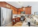 Well-equipped kitchen boasts stainless steel appliances, stylish countertops, and ample cabinet space at 7710 Bucknell Terrace, Fairburn, GA 30213