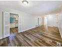 Open-concept living space with modern floors that connects to a bright, inviting kitchen at 1596 Allgood Rd, Stone Mountain, GA 30083