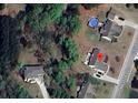 Aerial view of property showing house with roof and pool at 969 Golden Meadows Ln, Loganville, GA 30052