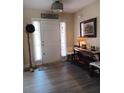 Inviting entryway with gray floors and charming decor at 969 Golden Meadows Ln, Loganville, GA 30052