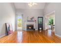 Bright living room with a fireplace, vaulted ceiling, and hardwood floors at 1469 Crescent Walk, Decatur, GA 30033