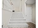 Carpeted staircase leading to the upper level of the home at 990 Trestle Dr, Austell, GA 30106