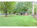 Expansive backyard offering plenty of green space and privacy at 2416 Timber Ridge Ct, Decatur, GA 30032