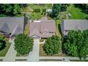 Aerial view of a well-maintained home featuring a large yard with mature trees and landscaping at 3370 Battlement Cir, Loganville, GA 30052